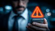 © kaliel - Neon warning triangle hovering above a smartphone conveys instant security alerts, spotlighting mobile threat detection and the necessity of rapid cyber response.