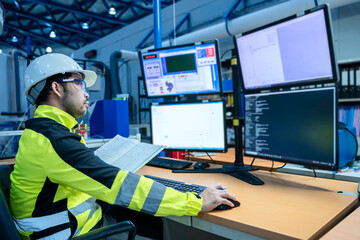 engineer working at control room,manager control system,technician man monitoring program from a lot