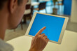 © Riaz - Man using tablet computer technology blue screen