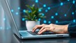 © MANNAN905 - Hands typing on laptop keyboard with digital network background technology