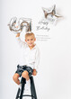 © Elena - Smiling Boy Celebrating 5th Birthday with Balloon