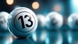 © Oleksandr - Close-up of lottery ball with number 13, against a blurred background, symbolizing luck and chance in gaming.