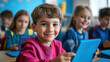 © Julia Zarubina - smiling primary school students with tablets sitting at desks in classroom, computer technology in education, school, children, lesson, learning