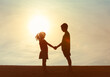 © kieferpix - Two children shaking hands, getting along, making up, childhood relashionships