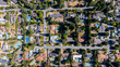 © Monet_P - Drone aerial shot of upscale hillside homes surrounded by trees and private pools in a quiet luxury neighbourhood near San Jose, California