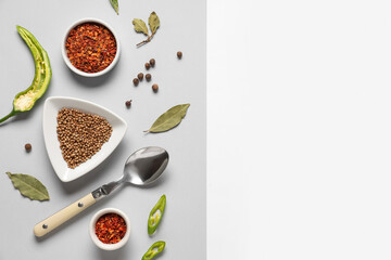 Wall Mural - composition with different spices and spoon on light background