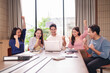 © Pichsakul - Asian business professionals team celebrate project success reaching goals achieving great results through collaborative effort in modern office meeting room