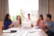 © Pichsakul - Blurred Business Professionals Team Meeting Collaboration Office Setting Asian Adults Discussion Strategy Session Abstract View