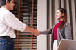 © Pichsakul - Asian business professionals shaking hands achieving agreement positive collaboration new partnership modern office setting professional development networking success