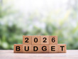 © maybeiii - Wooden blocks with the word BUDGET and number 2026. The concept about budget planning and allocation in year 2026