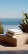 © qohhar - Two blank books stacked on a light wooden platform outdoors, overlooking a tranquil ocean scene