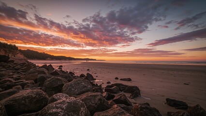 Wall Mural - Sunset hues reflecting on the shore at low tide