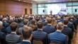 © David Zarzosa - Audience attending professional business conference or seminar in formal attire.