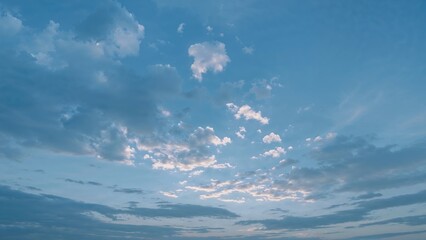 Wall Mural - Dreamlike sky blending blue and pink tones at dusk with cloud formations