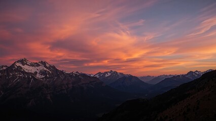 Wall Mural - spectacular sunset scene featuring mountains beneath a glowing twilight sky