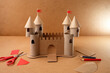 © Elena - Cardboard medieval castle with towers and drawbridge made from recycled materials, ideal for educational publishers, eco brands, kids crafts, storytelling content and school project visuals,