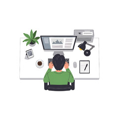 Overhead view of person working at desk with computer and accessories