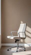 © Faziljan - Modern white office chair in a bright room. Dynamic light creates inviting shadows.