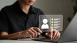 © Graphics_Bazaar - Man meticulously reviews candidate profile with checklist and verified status on futuristic digital interface, streamlining HR processes and talent acquisition.