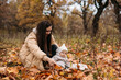 © ADDICTIVE STOCK - Mother and child enjoying fall in a leafy park