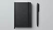 © Arman - Black notebook with elastic closure and matching pen writing stationery