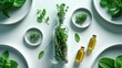 © Lasvu - Fresh herbs and plants in bowls, a glass bottle, and small oil bottles arranged on a white surface.