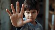 © Sanjaya - Brave Little Boy Raising Hand Saying No – Child Protection and Awareness Concept