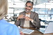© insta_photos - Mature happy professional business man executive, male hr or bank manager or financial advisor having job interview or business conversation consulting talking at corporate office onboarding meeting.