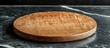 © Demdem - Round Wooden Cutting Board on Marble Surface