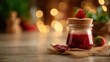 © sukarman - Homemade Strawberry Jam in Glass Jar with Cork Lid and Spoon on Burlap