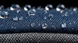 © guntur - Water droplets on dark blue and gray fabric