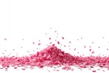 Pink rose petals cascading from a pile