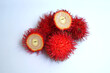 © Natural Sri  - Close-Up of Ripe Rambutan Fruit Isolated on White Background.