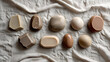 © EMDADUOL HAQUE  - Balanced flatlay composition of handmade soap stones in beige and yellow on a neutral linen backdrop