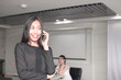 © khwanchai - Portrait leader or manager Asian Businesswoman calling phone in office