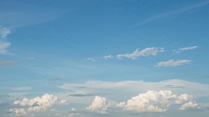 Wall Mural - Nature panorama featuring white clouds and a clear blue sky