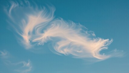 Wall Mural - Clouds drifting across a bright blue daytime sky