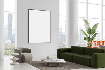 Poster - Modern interior with framed blank poster on clean wall in luxury living room featuring green sofa, gray armchair and city view through large windows. 3D Rendering