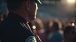 © Sylvia - Security guard standing alert near an event entrance, uniformed with a soft-lit background and blurred crowd.