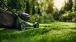 © Sawyer0 - A freshly mowed green lawn with a lawnmower resting on it, surrounded by a blurred background of a well-maintained garden.