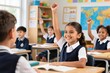 © MastersedZ - Smiling girl raising hand in classroom, diverse children in school uniform, learning, education, cheerful atmosphere, elementary students