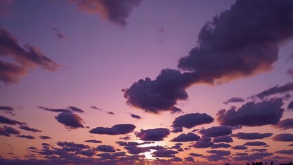 Wall Mural - Breathtaking 4K time lapse footage sunset sky filled uniquely shaped clouds golden hues capturing mesmerizing transformation daylight twilight natural