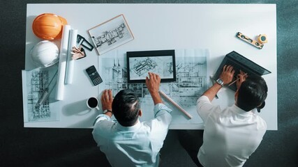 Poster - Top view of skilled civil engineer working together to plan building design while using laptop. Professional architect team sitting at table while manager using tablet open project plan. Alimentation.