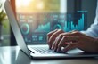 © Pete - Businessman hand uses laptop with real estate graphics. Office environment, daytime. Focus on property management, market analysis, financial investment, housing market trends, architectural design,