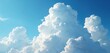 © Pete - Vast blue sky with dramatic fluffy cumulus clouds. Close-up view of bright white cloud formations against clear sky background. Natural weather phenomenon, summer atmosphere, good for design