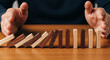 © Aimo Studio - Stopping the domino effect concept for crisis management risk control and business strategy planning