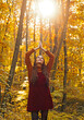 © Volodymyr - Woman with autumn leaves. Woman near autumn fall leaves in park. Girl on autumnal fall background. Foliage, falling leaves background, autumn leaf and people concept. Autumn portrait.