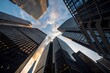 © abdul - Soaring skyscrapers reflect golden hour light, capturing the dynamic energy of a modern cityscape from a unique low-angle perspective.