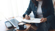 © tippapatt - Business woman planning daily appointment and writing on business calendar planner notebook at office. event planning, Planner plan schedule calendar and reminder agenda