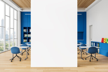 Poster - Blank vertical poster mockup in bright modern classroom interior with blue furniture and wooden floor, ideal for educational design concepts. 3D Rendering